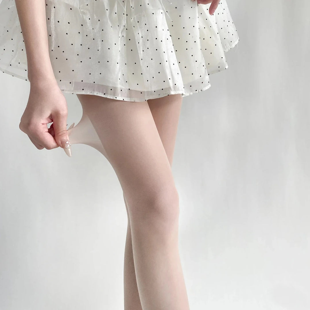 Vibe Legwear: sheer nude tights with smooth texture and seamless finish.