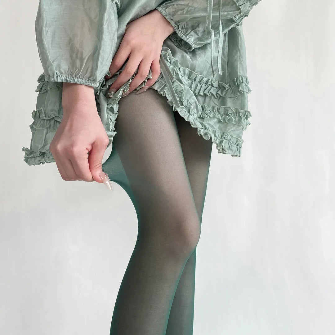 Vibe Legwear: sheer green tights with ruffled hem detail.