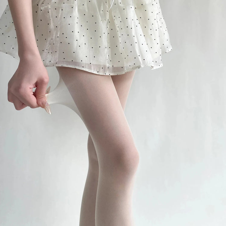 Vibe Legwear: sheer nude tights with smooth texture and delicate fit.