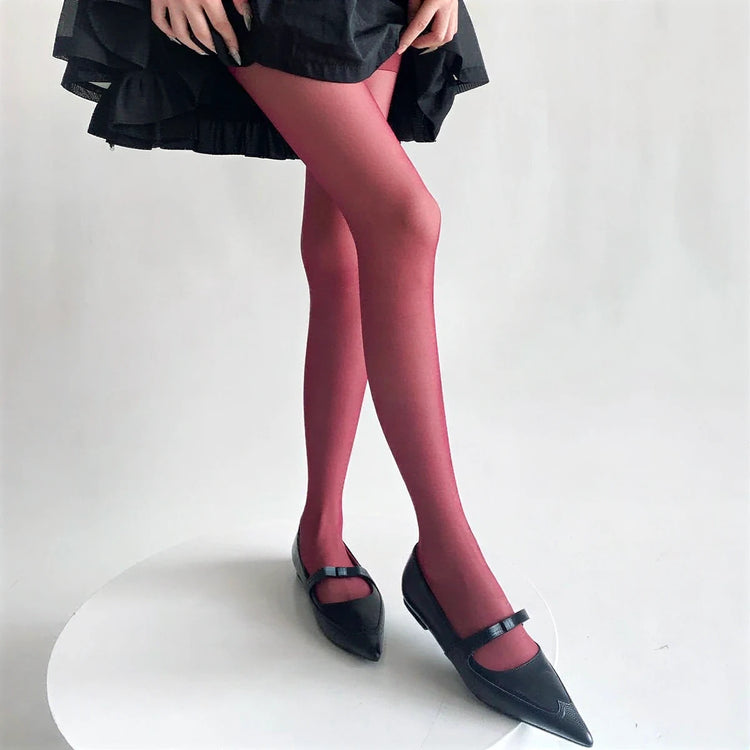 Vibe Legwear: smooth, solid red sheer tights with subtle sheen and seamless finish.