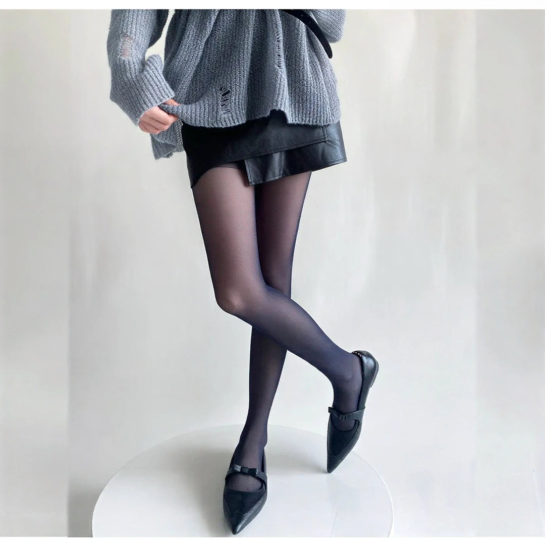 Vibe Legwear: sleek black sheer tights with smooth finish and subtle sheen.