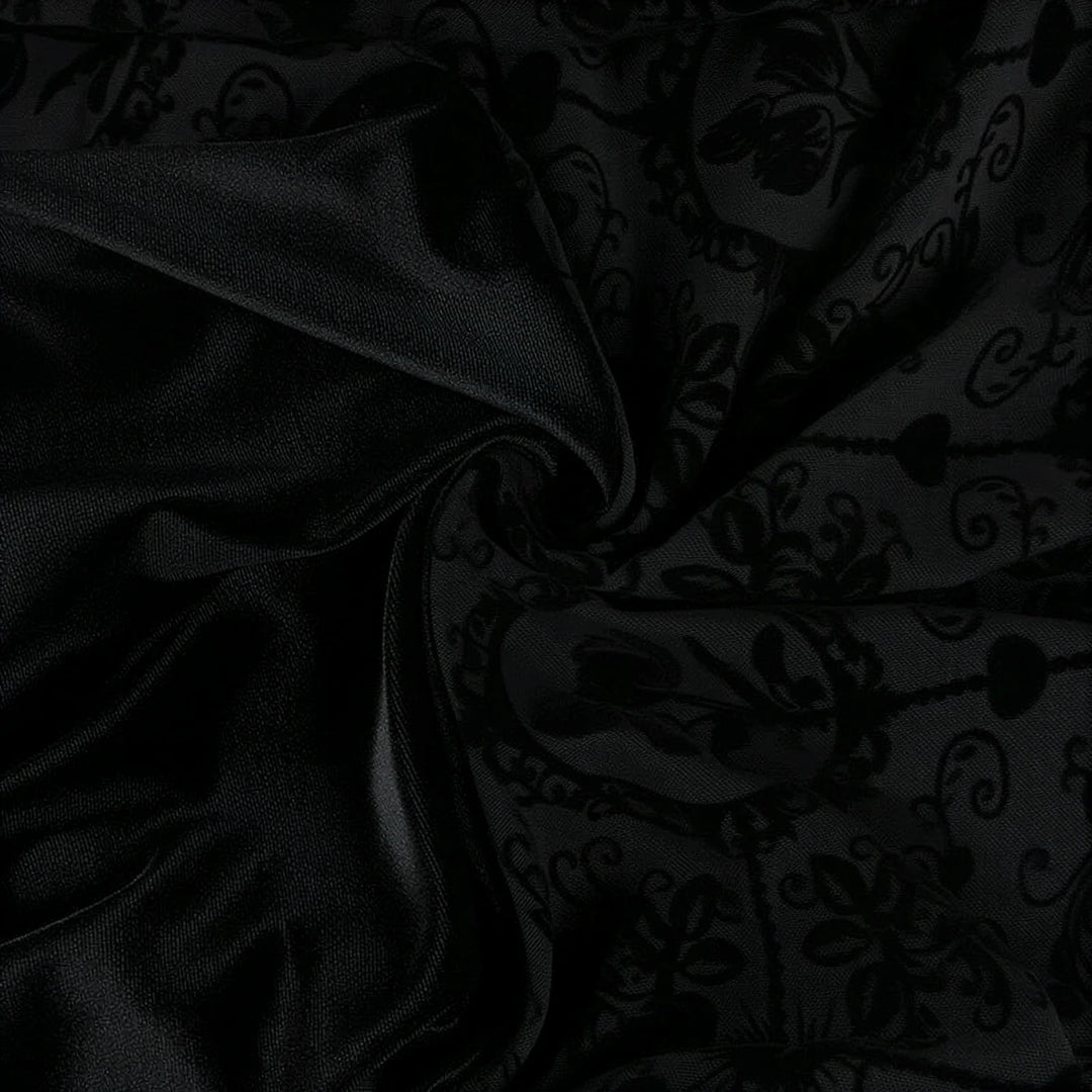Vintage Goth Dress in black velvet with floral patterned overlay.