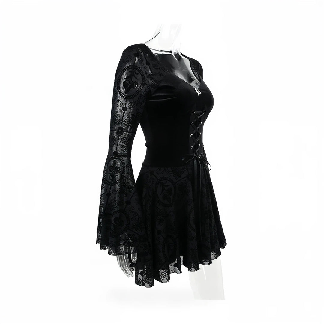 Black vintage goth dress with lace sleeves and corset back.
