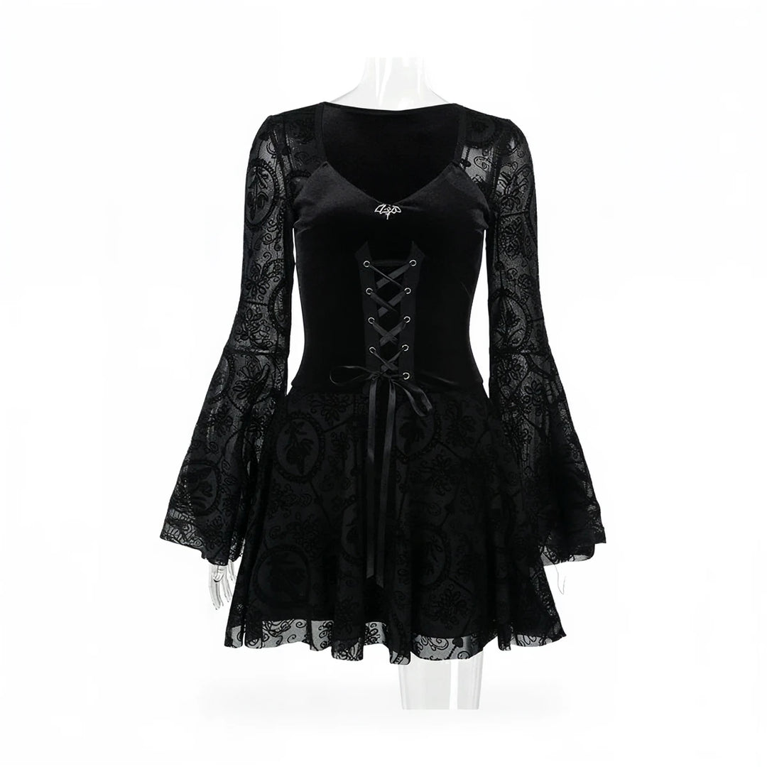 Black vintage goth dress with lace sleeves and corset lacing.