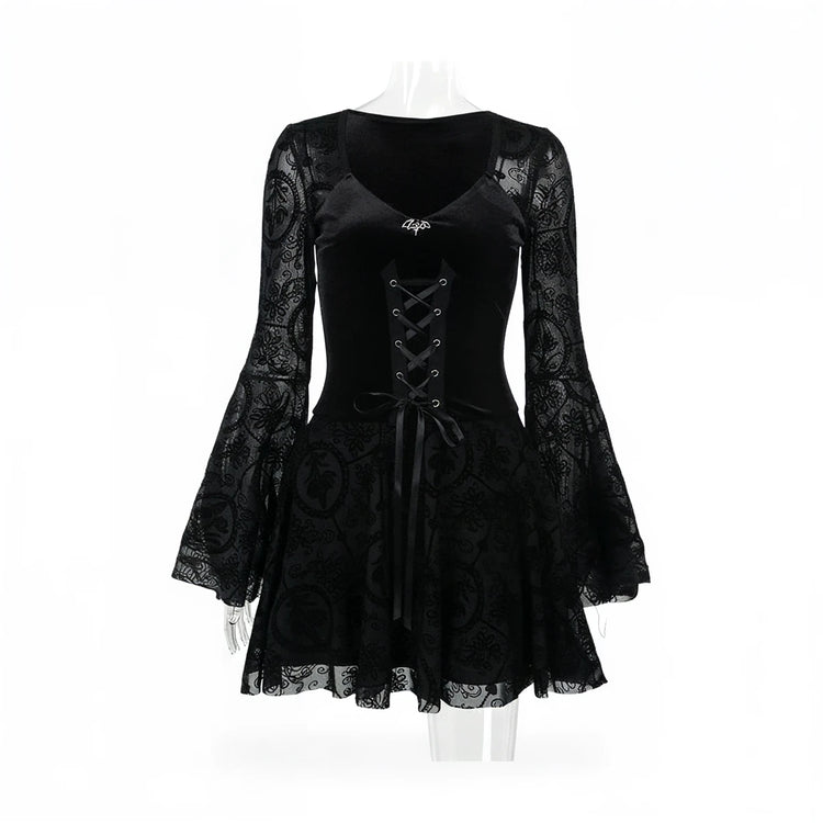 Black vintage goth dress with lace sleeves and corset lacing.