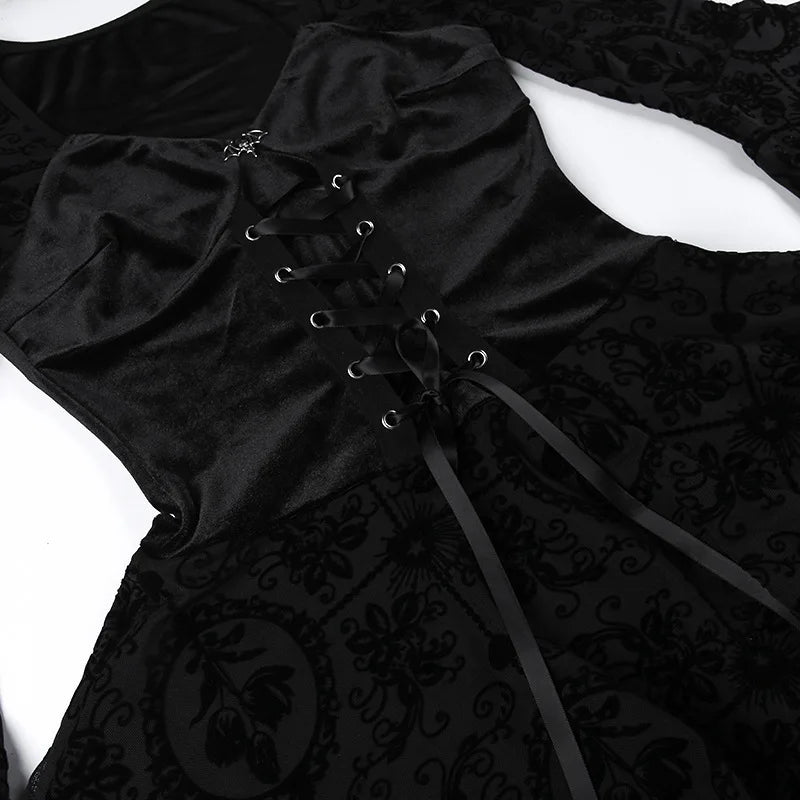 Black velvet goth dress with lace-up front and ruffled neckline.