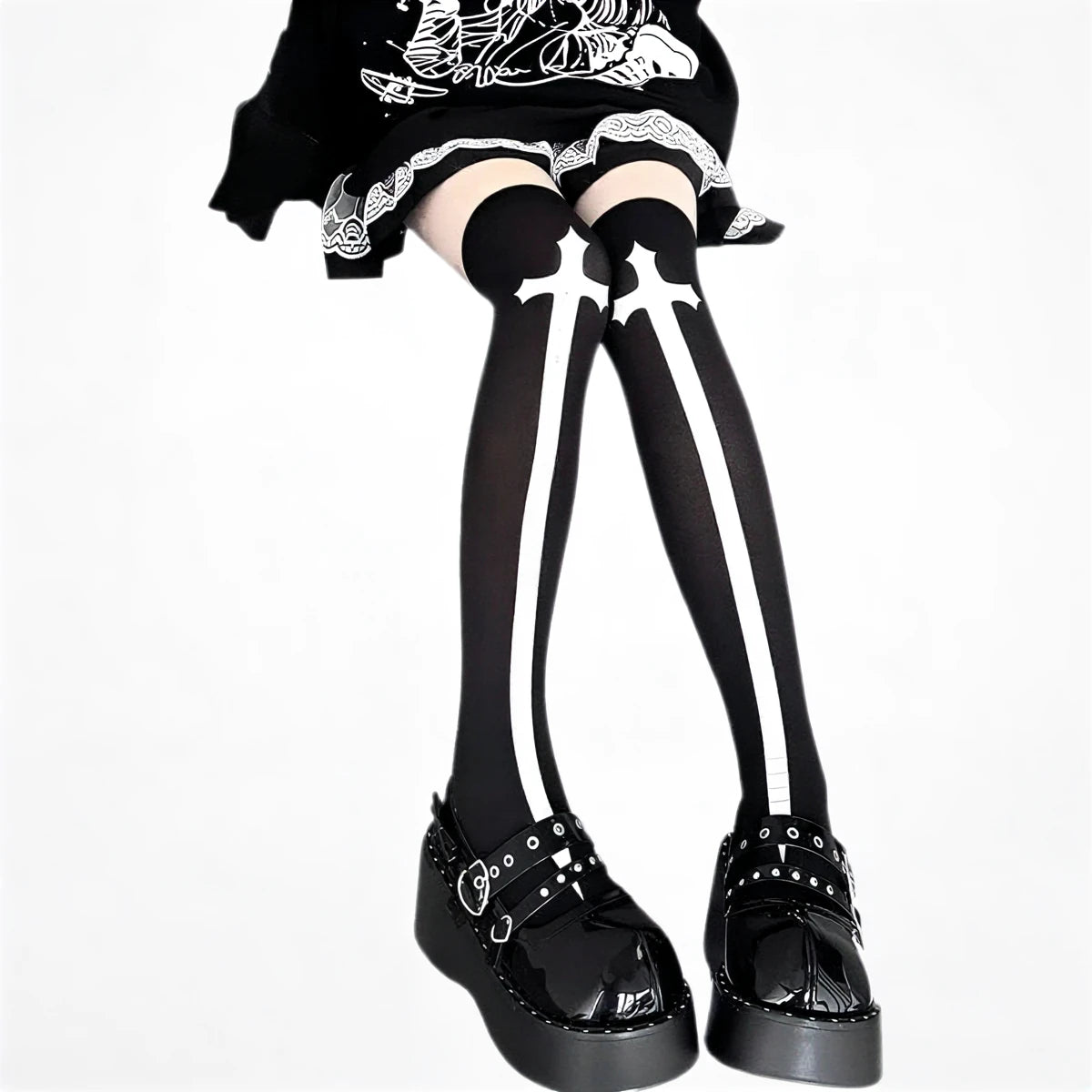 White cross patterned thigh-high stockings, black base, sheer material with bold white cross design.