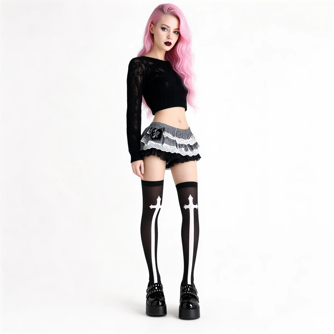 White cross patterned thigh-high stockings, black sheer fabric with bold white crosses.